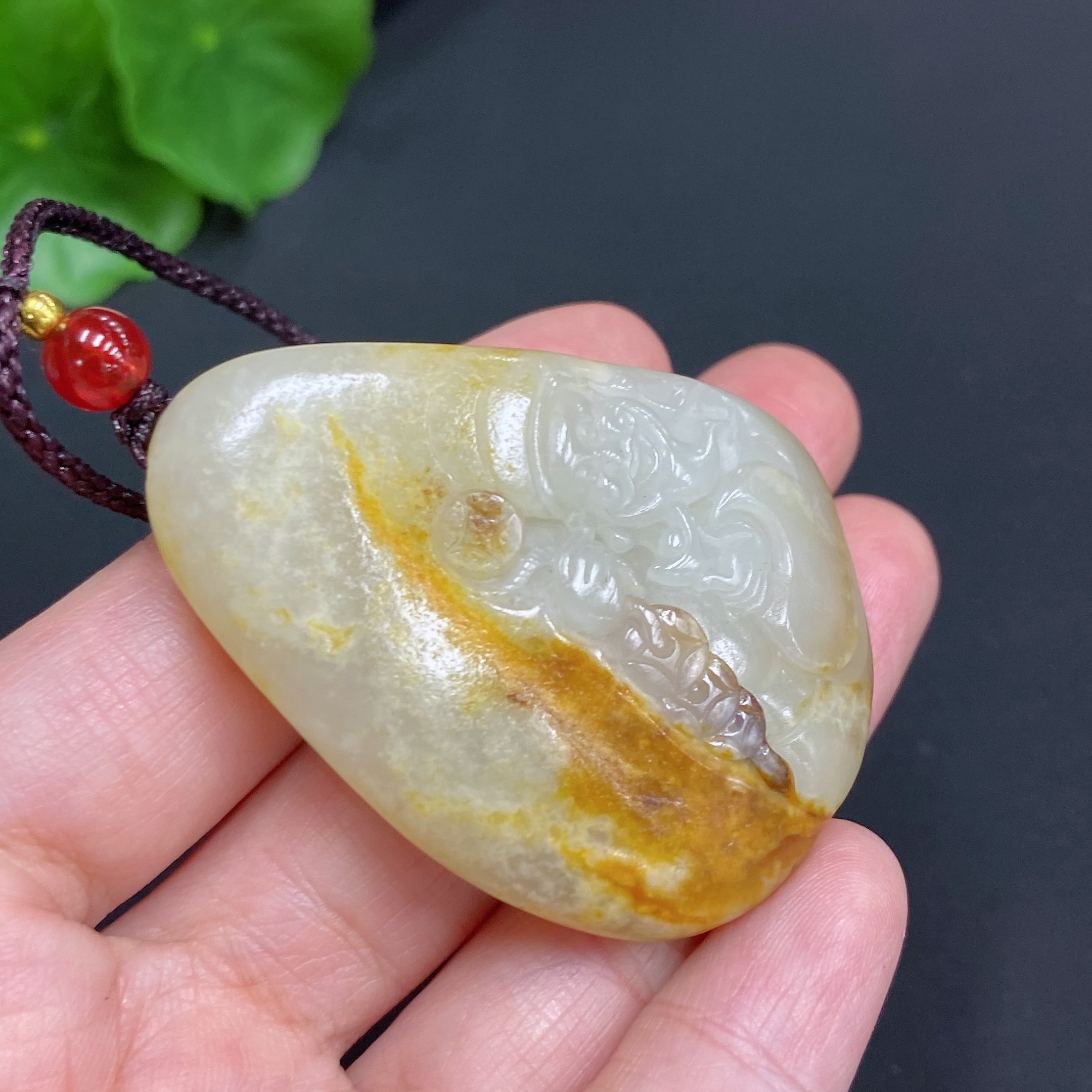 Hetian Jade Pendant    God of Wealth    Total Weight (including rope): 35.1g    Undetermined skin color cause
