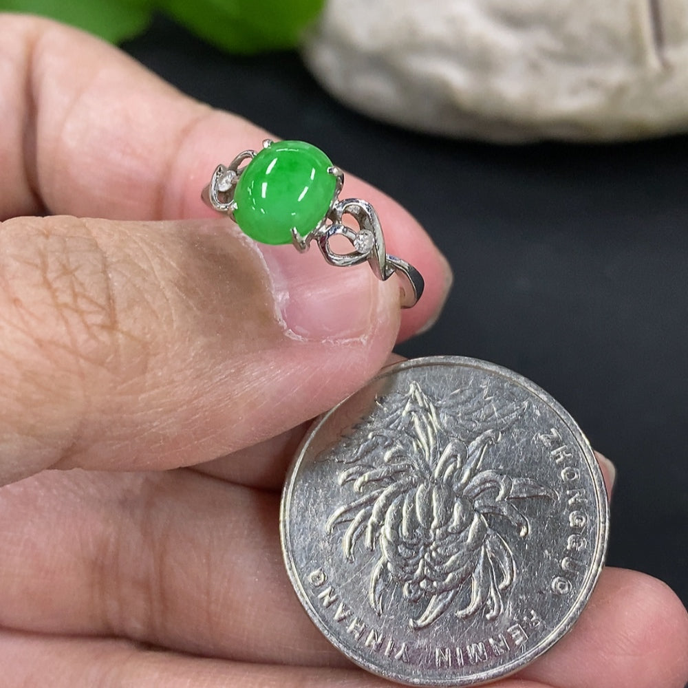 HKHQ jadeite cabochon ring in 18k gold setting, size 11.5, featuring a smooth green jade stone with a gold band.