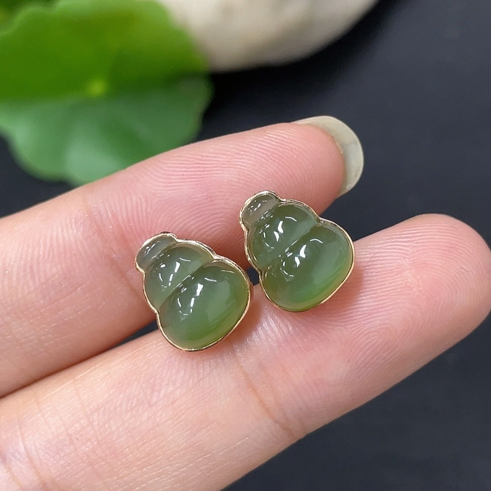 HKHQ Hetian Jade inlaid earrings with 18k gold, featuring elegant jade stones and ear stoppers, total weight 2.2g.
