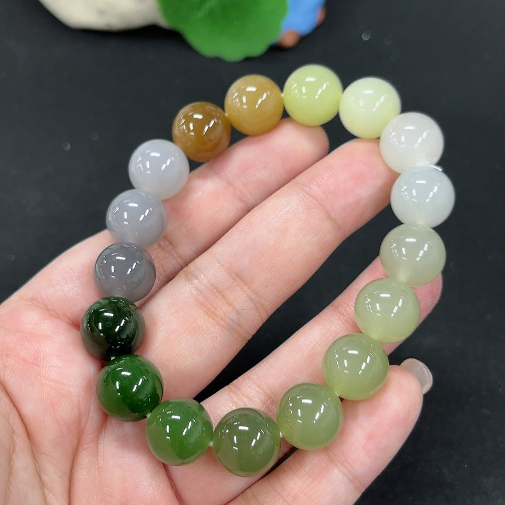 HKHQ Hetian Jade bracelet with smooth green stones, weighing 45.6g, featuring a polished and elegant design.