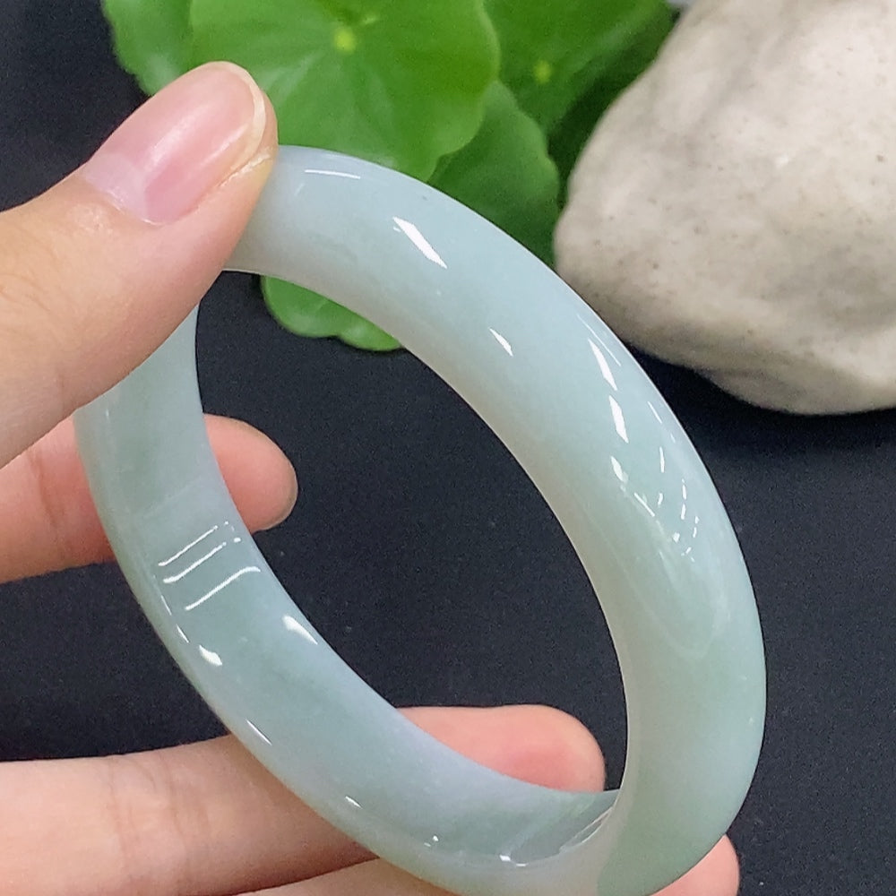 HKHQ jadeite round bangle, size 58.9, with a total weight of 56.8g, showcasing smooth, polished jadeite surface.