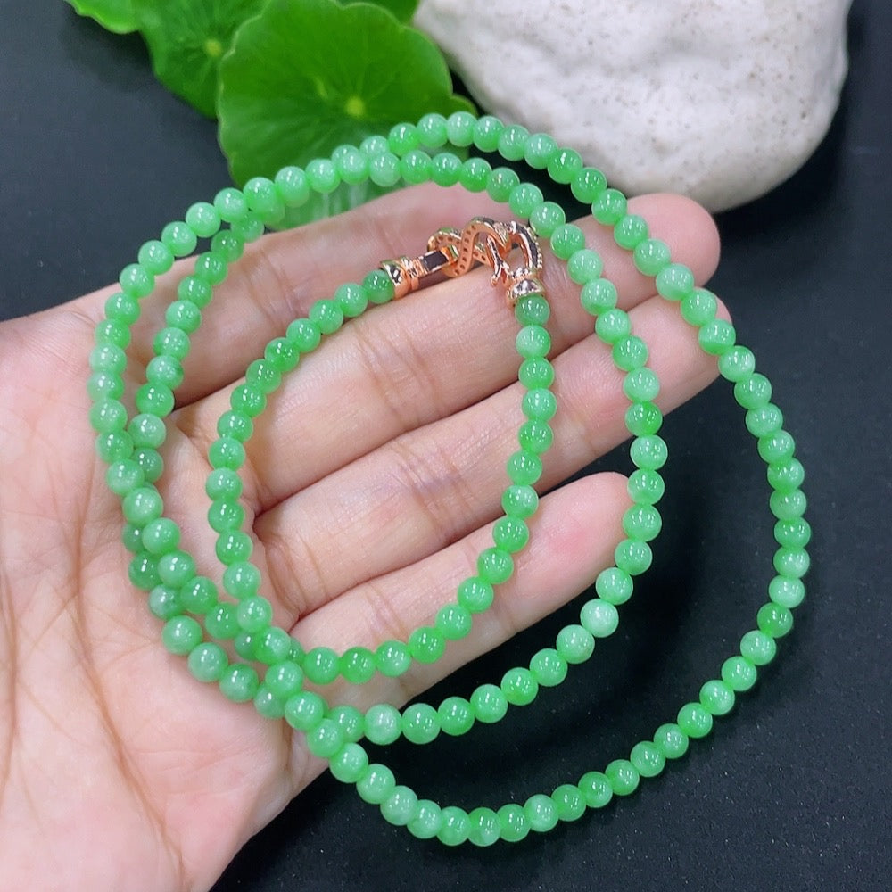 HKHQ jadeite bead necklace featuring smooth green beads, non-gold, weighs 17.87g, elegant jewelry accessory.