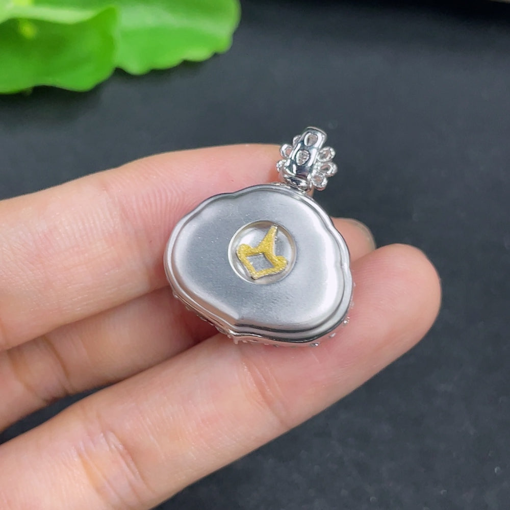 Jadeite pendant with 18k gold and diamond accents, showcasing a smooth jade gemstone on a delicate chain.