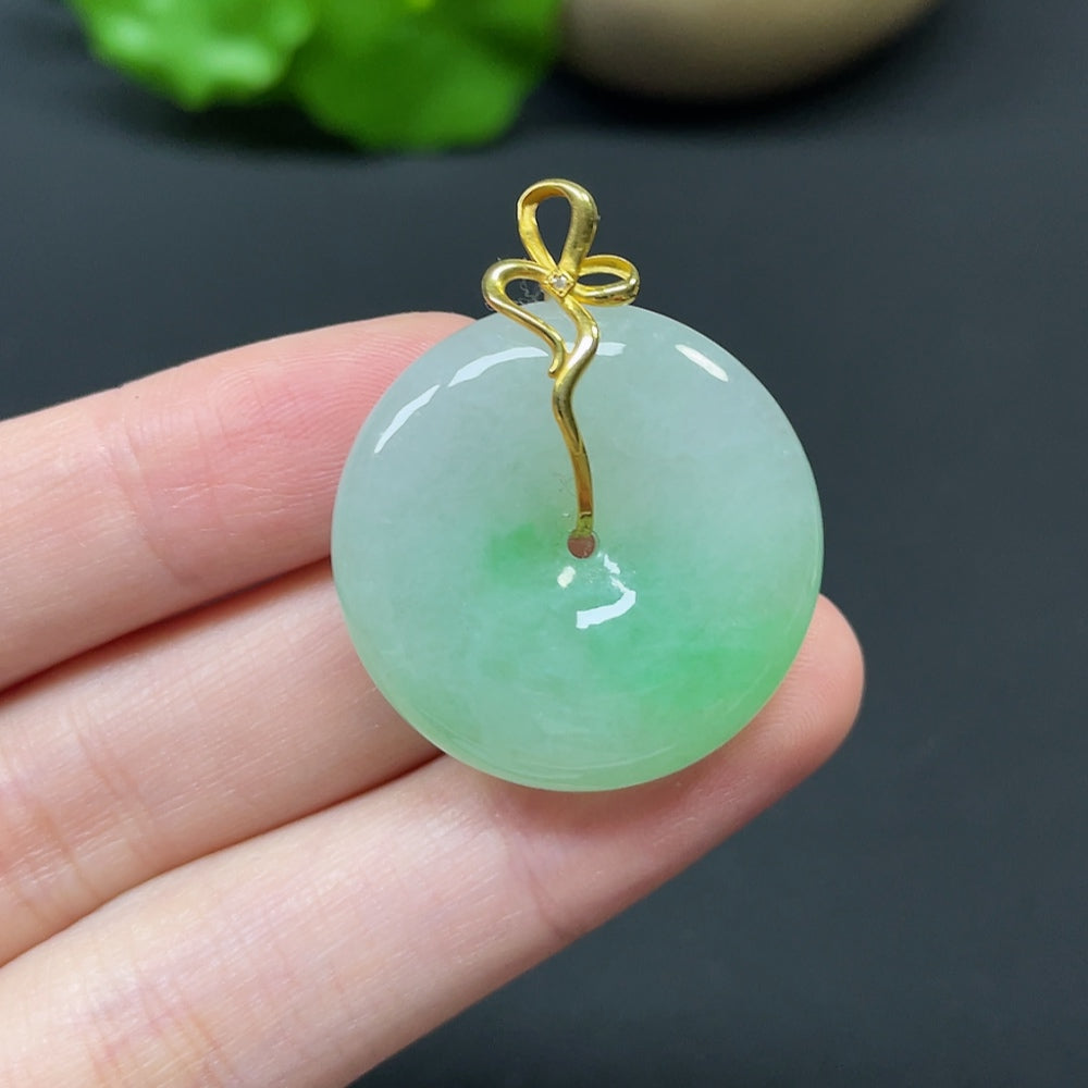 Jadeite Peace Knot pendant in 18k gold with diamond side stones, featuring intricate inlay design and a total weight of 10.92g.