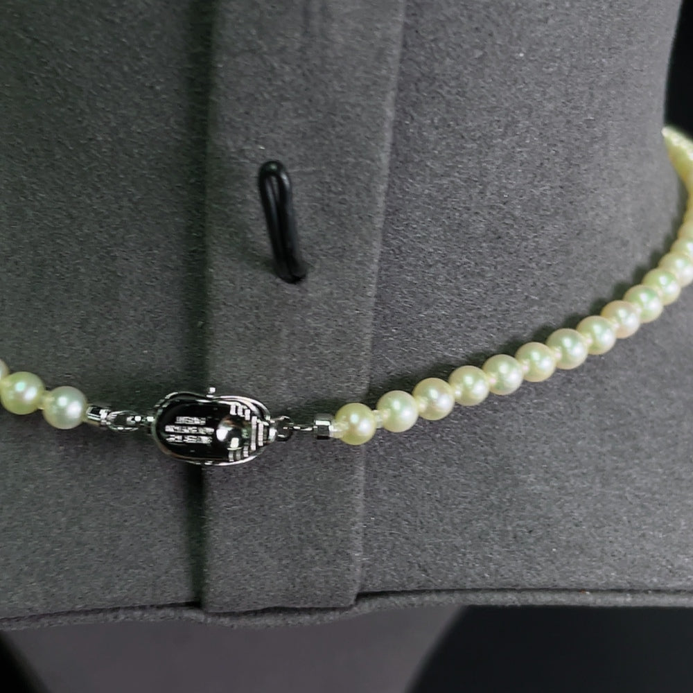 HKHQ seawater pearl strand with 4-4.4mm non-gold pearls, approximately 12.04g, featuring lustrous round pearls for elegant jewelry.