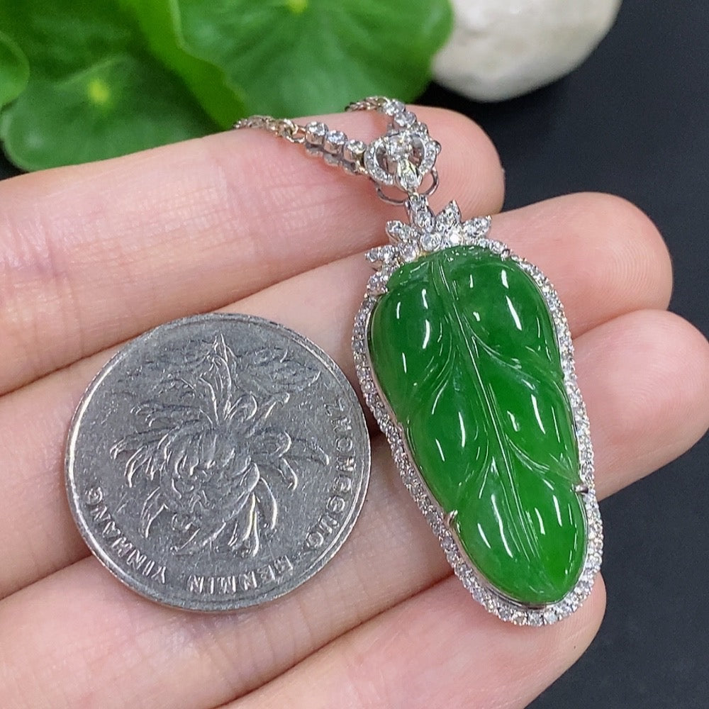 Jadeite leaf pendant with 18K gold and diamond accents, featuring a delicate design and a matching chain, weight approx. 12g.