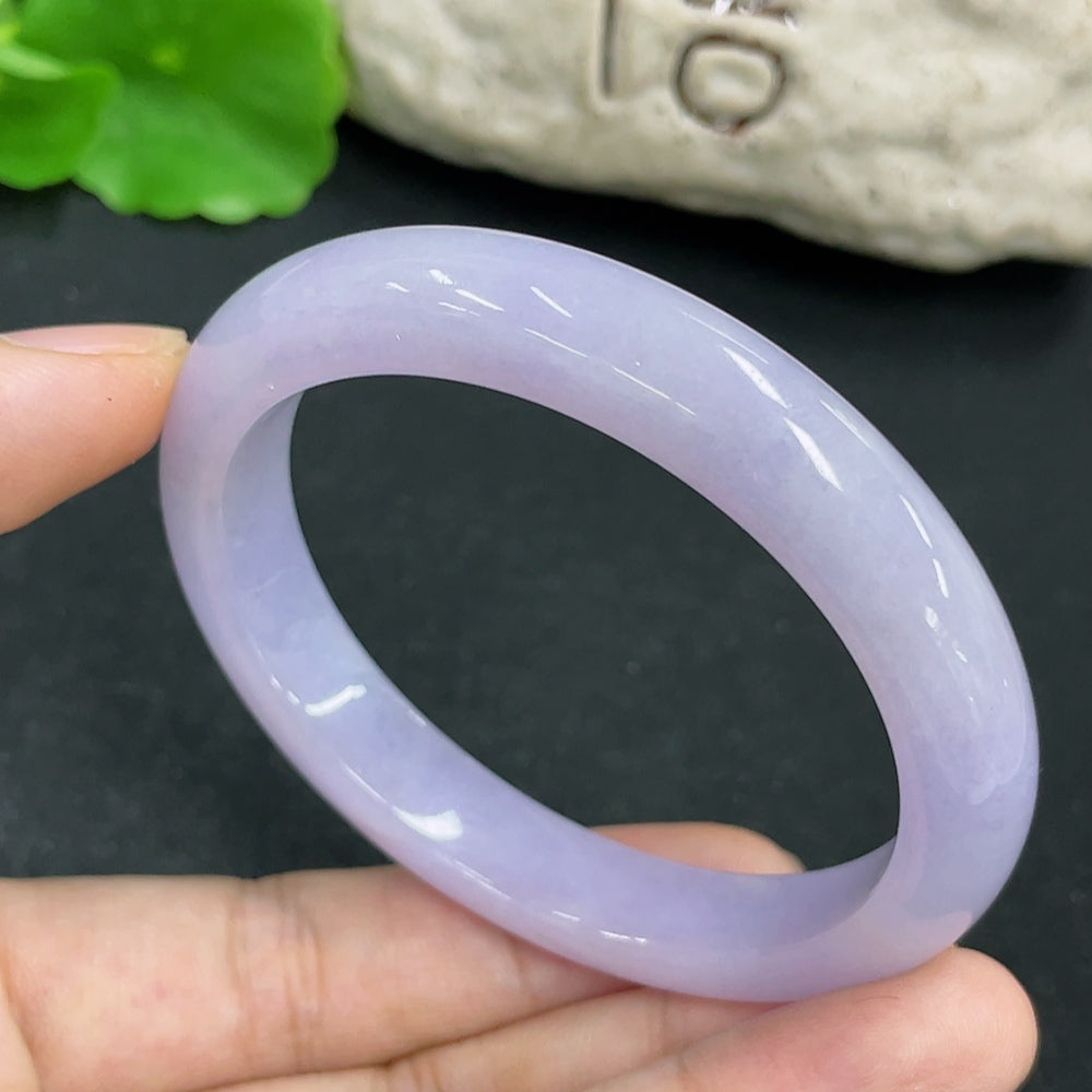 Jadeite Concubine Bracelet made of smooth green jade, featuring intricate carvings, from HKHQ.