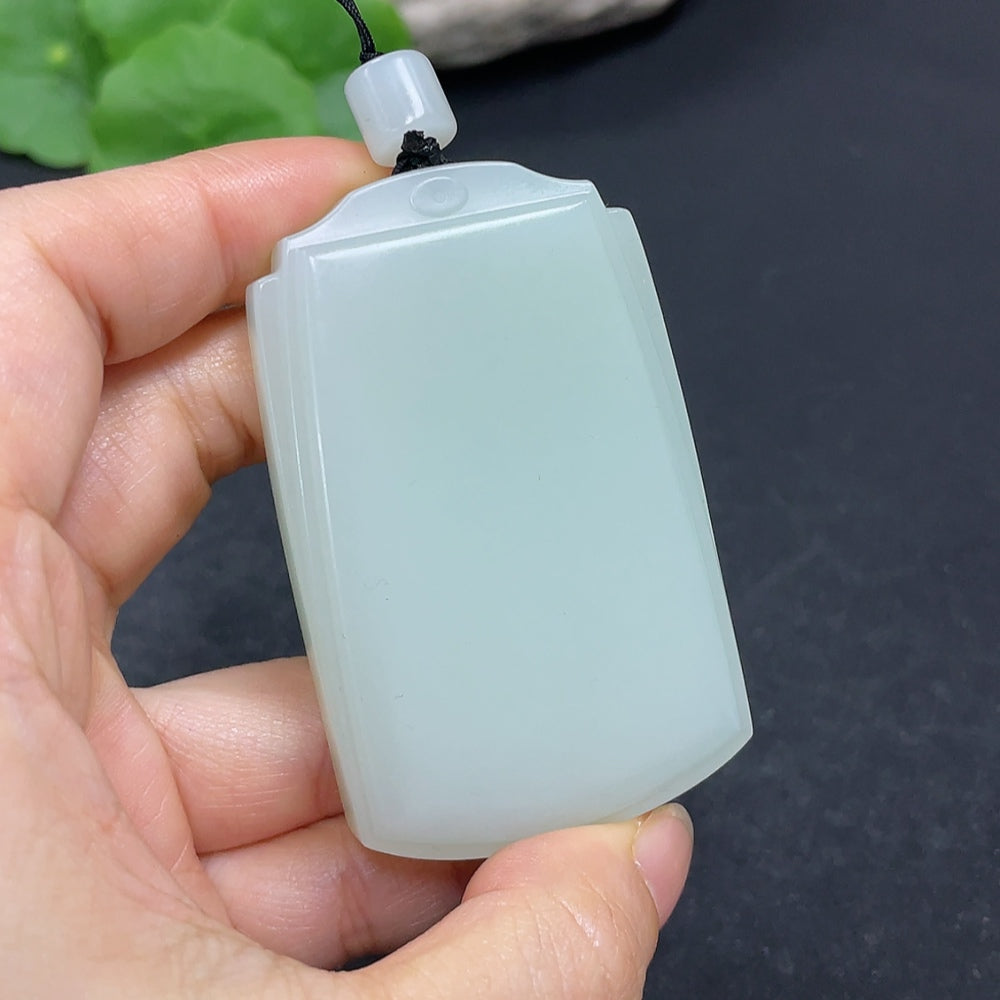 HKHQ Hetian Jade plain pendant necklace in natural light, showcasing smooth, polished jade with a simple elegant design.