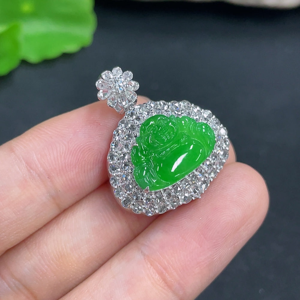 Jadeite pendant with 18k gold and diamond accents, showcasing a polished green jade gemstone, weighing approximately 7.3 grams.