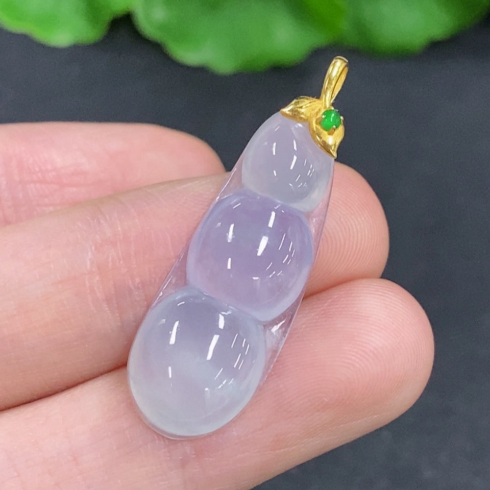 Jadeite lucky bean pendant with 18k gold clasp, showcasing smooth green jade and polished gold accents.
