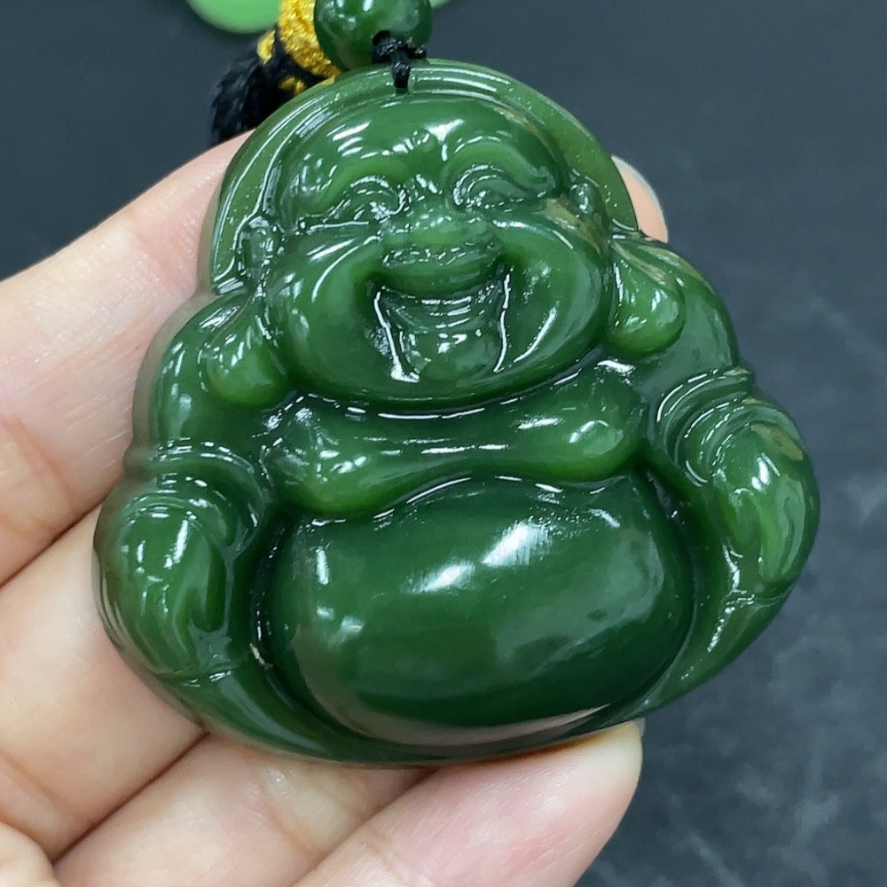 Hetian Jade Jasper Buddha pendant with rope, weighing approximately 42.2g, featuring detailed carved design and polished surface.