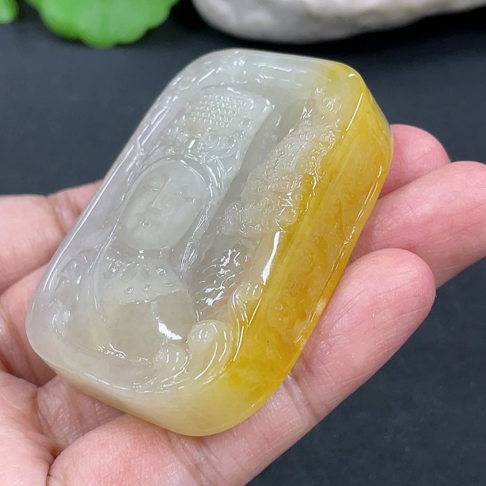 Jadeite Guanyin pendant in green jade with intricate carved details, weighing approximately 64.7g, by HKHQ.