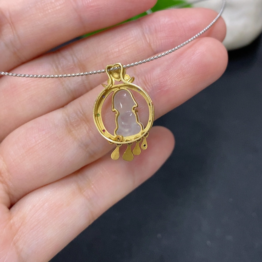 Jadeite inlaid pendant with 18K gold rope setting, featuring a polished green jade stone, by HKHQ.