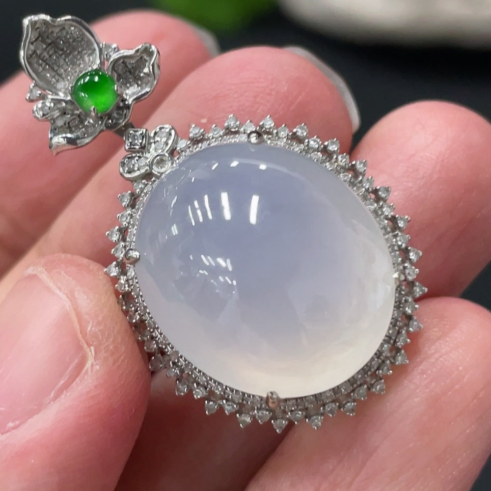 HKHQ jadeite cabochon pendant with diamond accents, featuring a polished green jade stone and sparkling diamond details.
