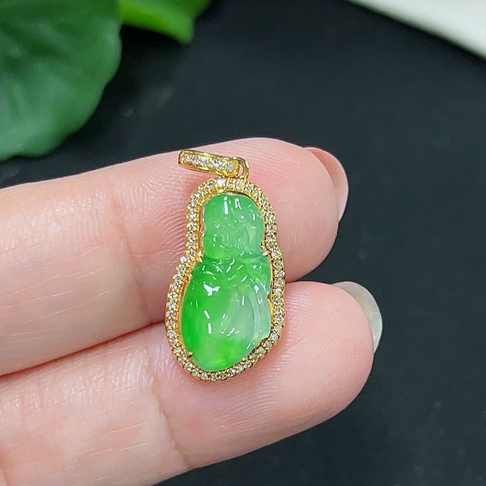 Jadeite pendant with 18k gold and diamond accents, featuring a smooth green jade stone, weight approximately 2.24g.
