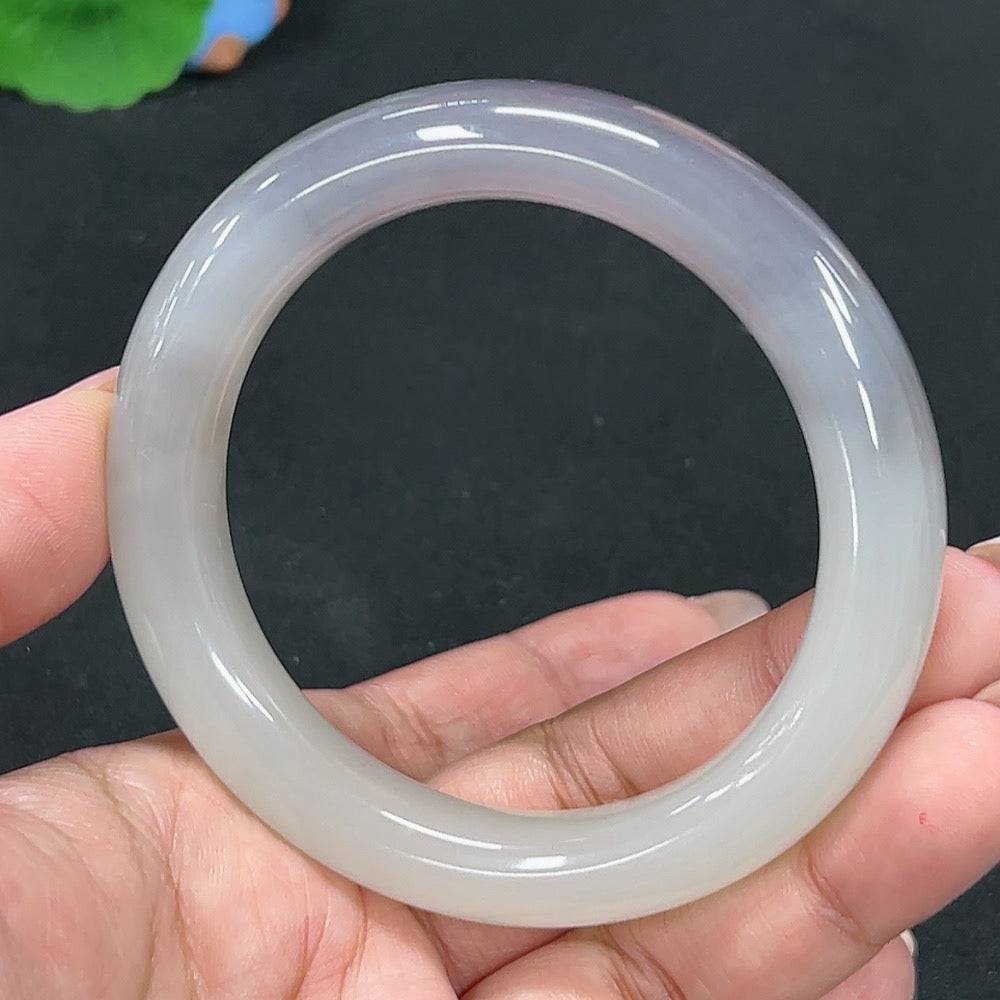Huiliu Certified Hetian Jade round bracelet featuring smooth, polished green jade beads on a delicate stretch cord.