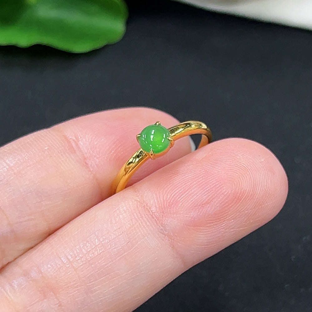 Elegant jadeite inlaid ring with 18K gold band from HKHQ, showcasing intricate jewelry craftsmanship and a polished finish.