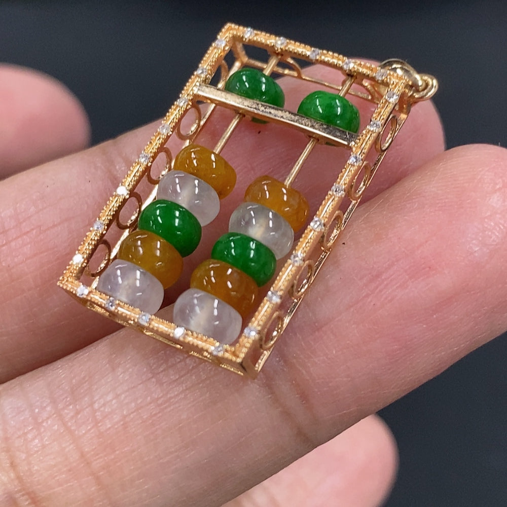 Jadeite pendant with 18K gold setting, accented with diamonds and mineral components, weighing approximately 3g.
