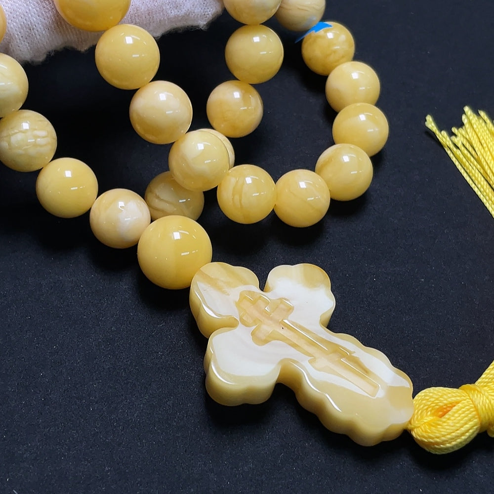Amber HKHQ beeswax bead strand with visible repairs, 11.4-14mm, weighing approximately 60.86g, natural amber jewelry component