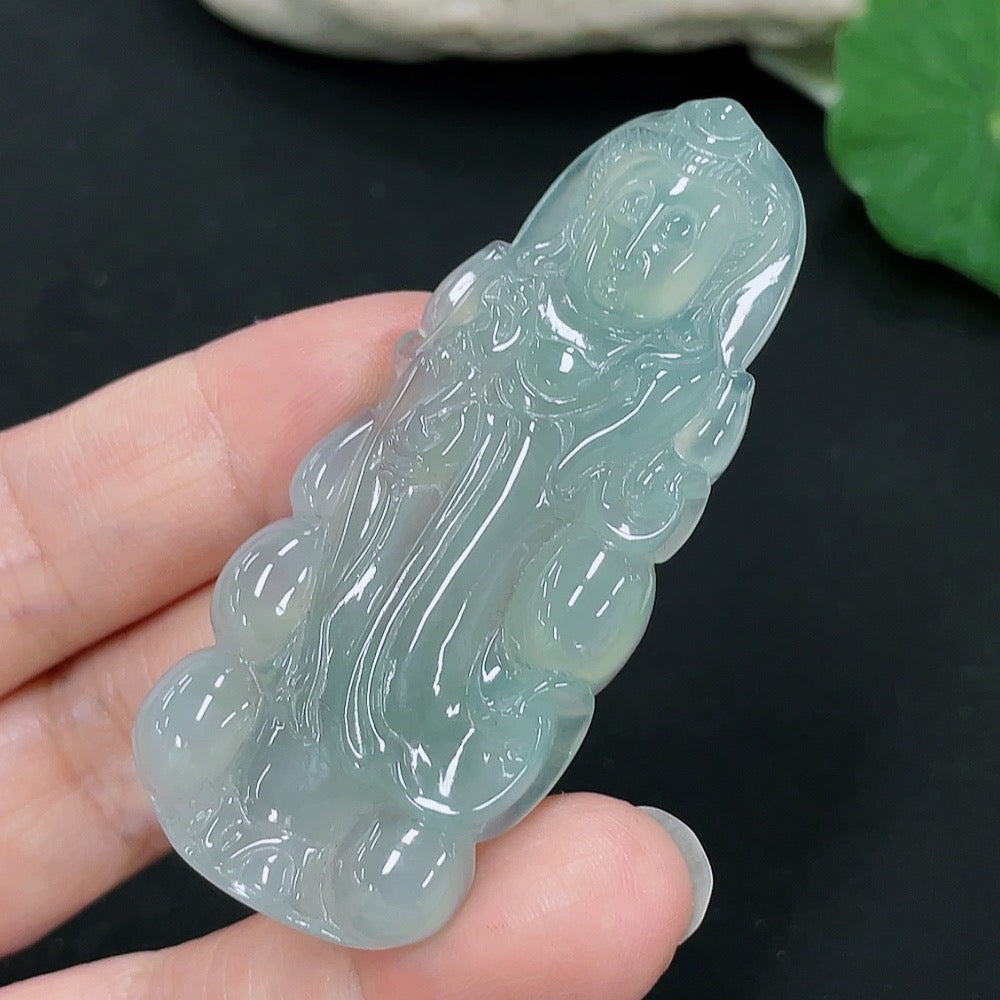 Jadeite Guanyin pendant from HKHQ, intricately carved in vibrant jade, weighing approximately 20.1 grams.