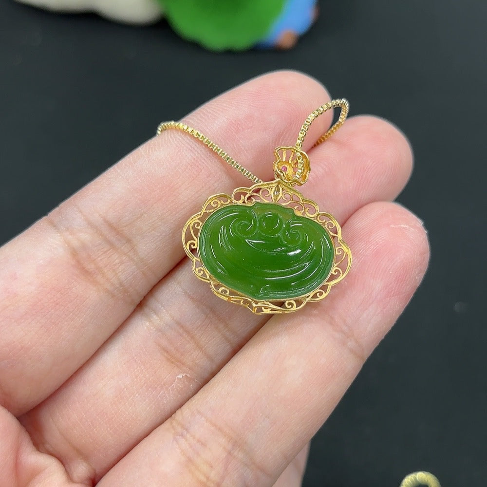 Hetian jade jasper inlaid pendant with Ruyi design on a necklace, featuring intricate craftsmanship and natural stone details.