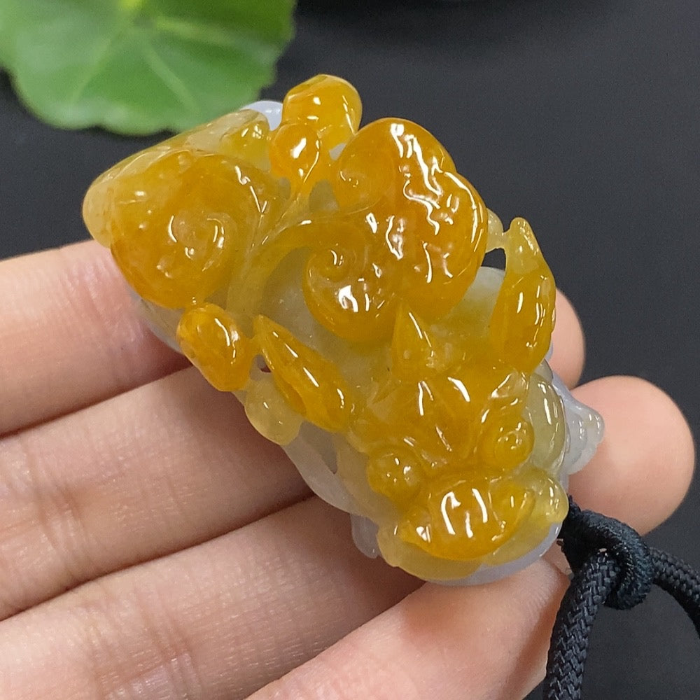Jadeite Pixiu pendant in green jade with detailed carving, weighing approximately 44.16g, from HKHQ.