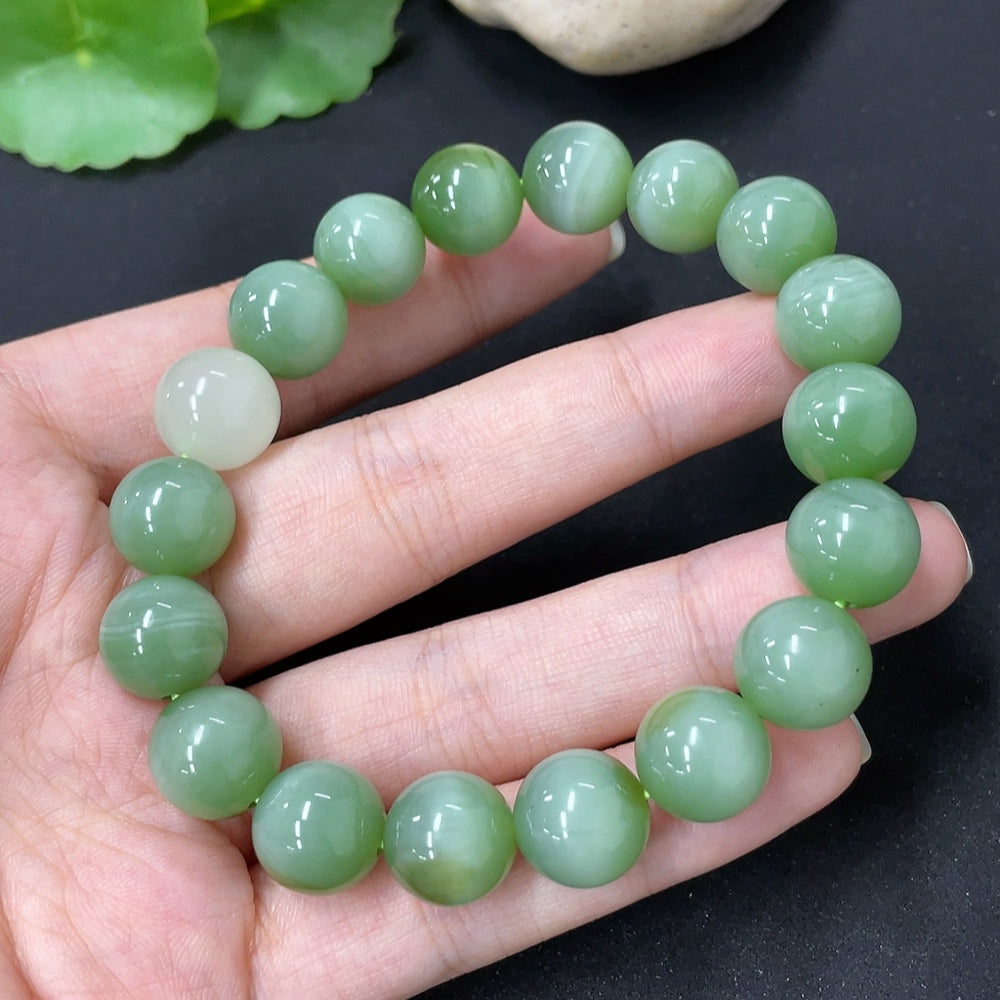 Hetian Jade bracelet with round bead stones from HKHQ, showcasing smooth, polished jade beads on a delicate bracelet.