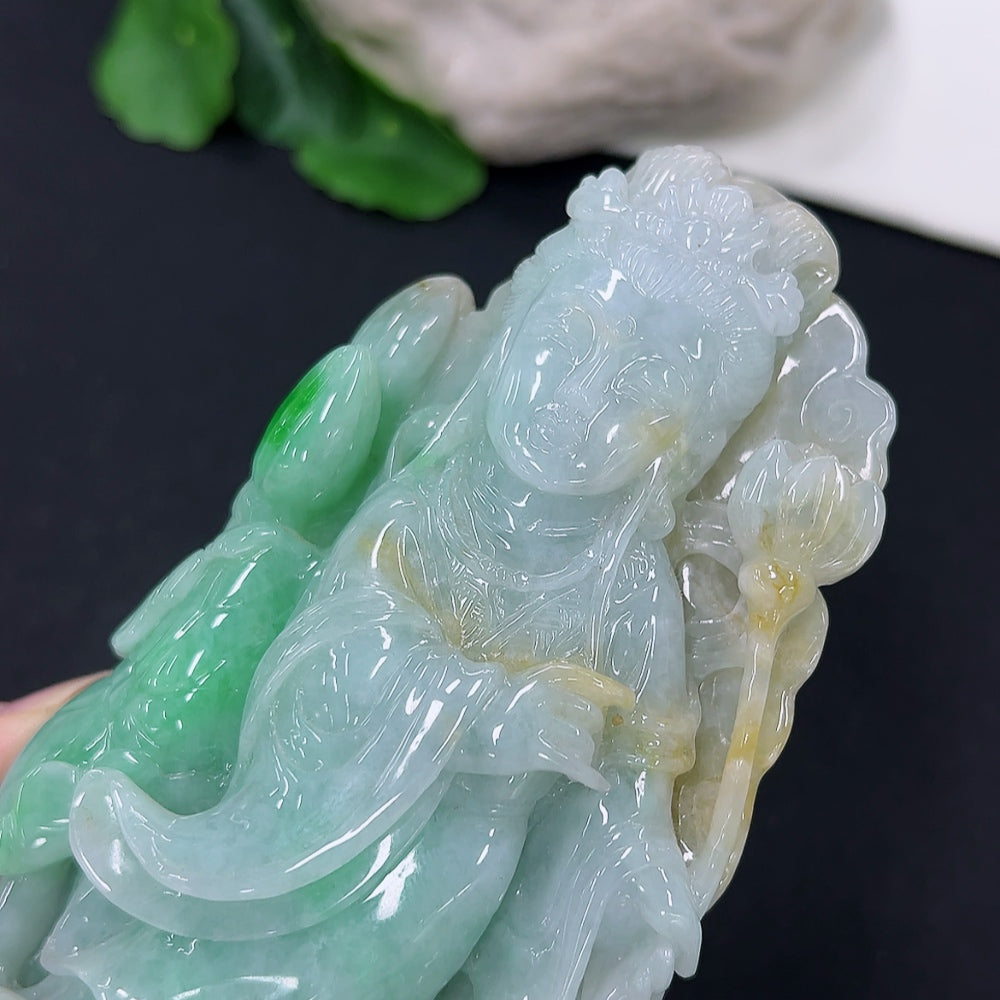 Jadeite He He Xiangu jewelry ornament with intricate carvings, featuring traditional Chinese design, on a plain background.