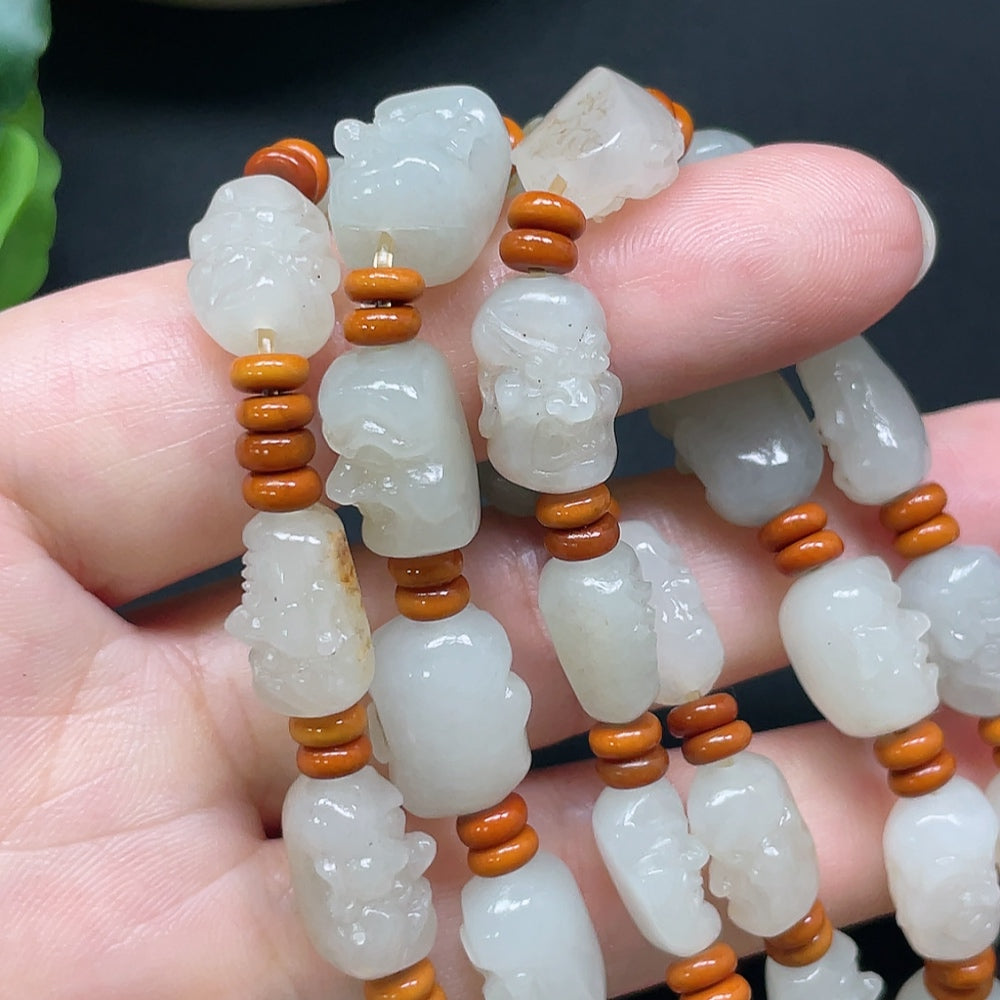 HKHQ Hetian Jade Eighteen Arhats bracelet with beaded string, weighing approximately 65.71g, featuring colorful beads and traditional design.