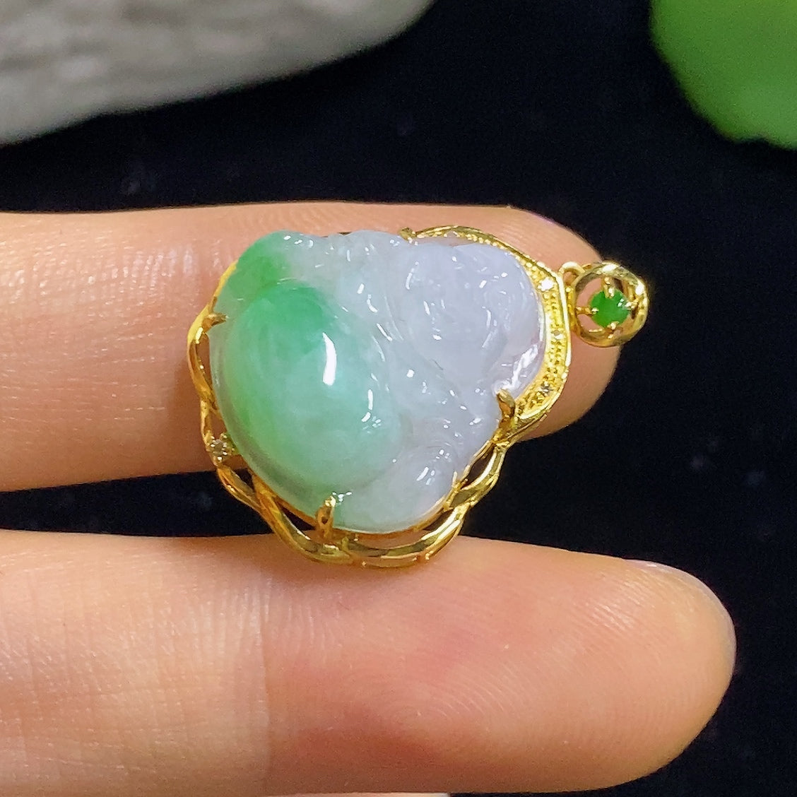 Jadeite Buddha pendant with diamond accents in 18K gold, weighing approximately 3.3g, featuring intricate inlay work.
