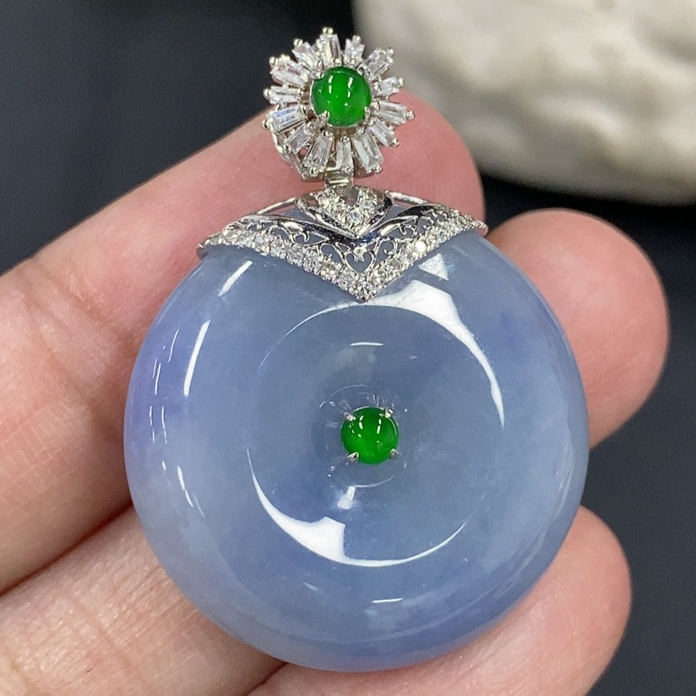 Jadeite Peace Knot pendant with 18K gold clasp and diamond accents, crafted by HKHQ, featuring a polished jade surface and intricate design.