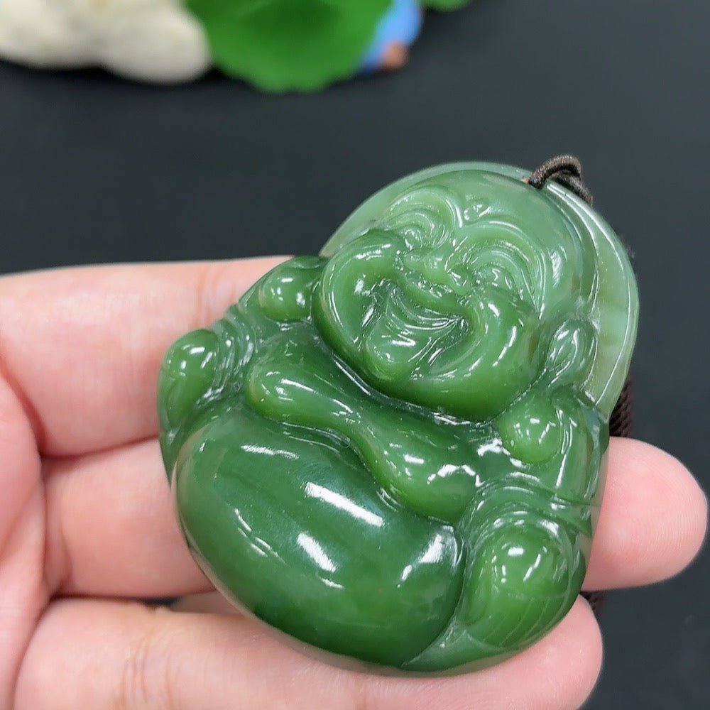 Hetian jade pendant featuring a Buddha design, weighing approximately 58.6g with rope, crafted by HKHQ.