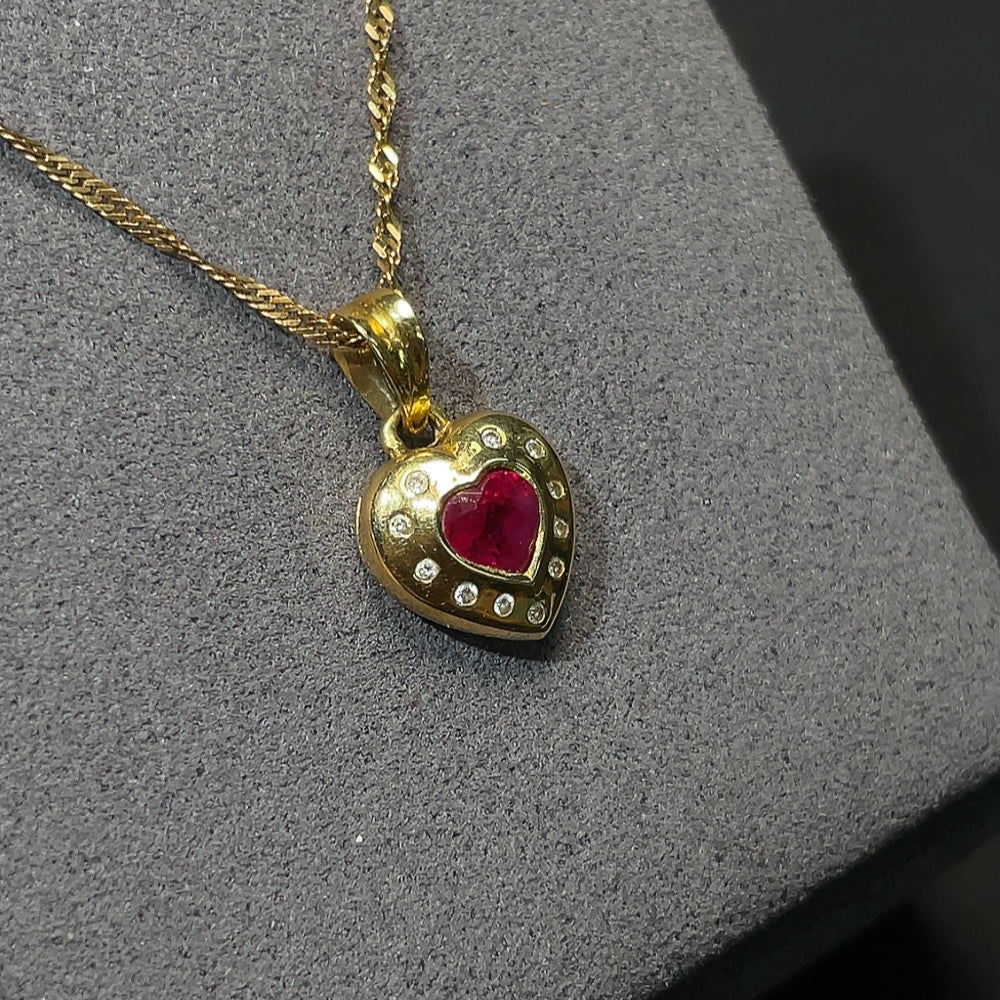 18K gold ruby pendant with diamond accents, total weight including chain approximately 4.14g