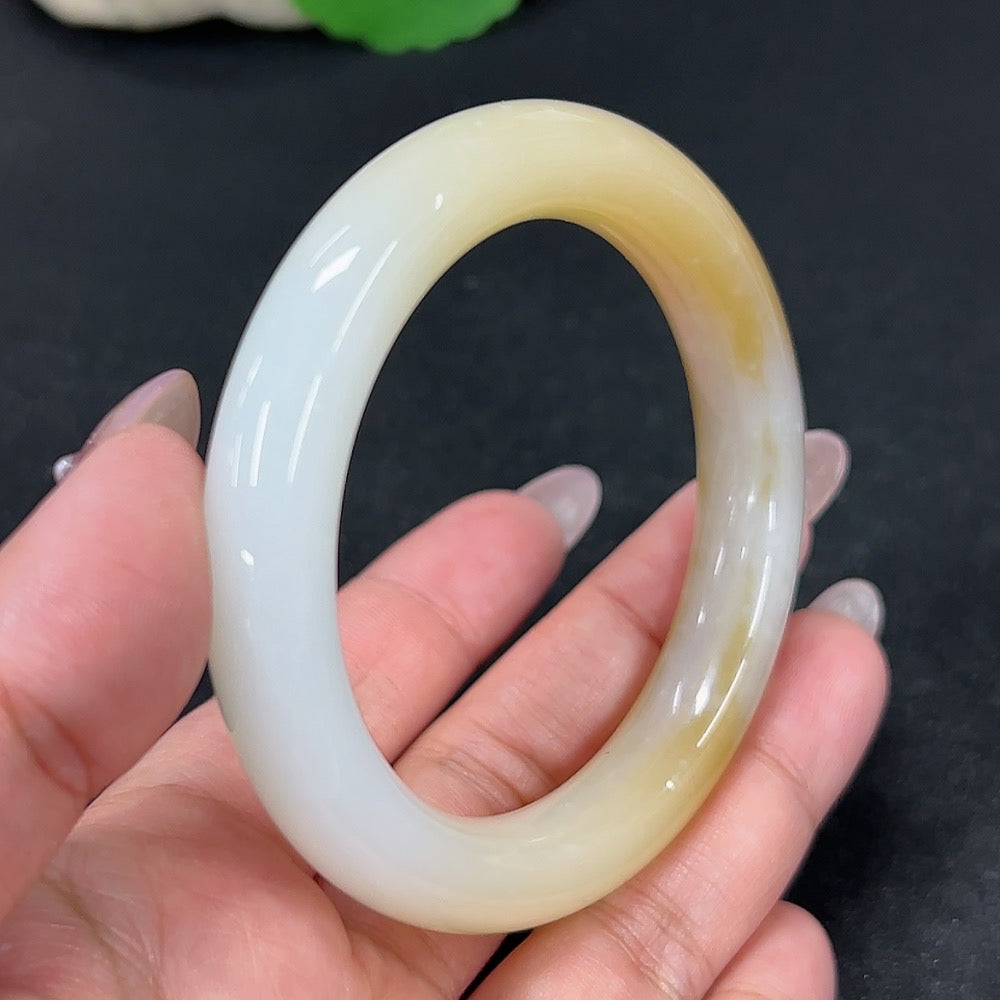 HKHQ Hetian Jade round bangle with mineral components, size 54.9, weighing approximately 54.9g, natural and polished appearance