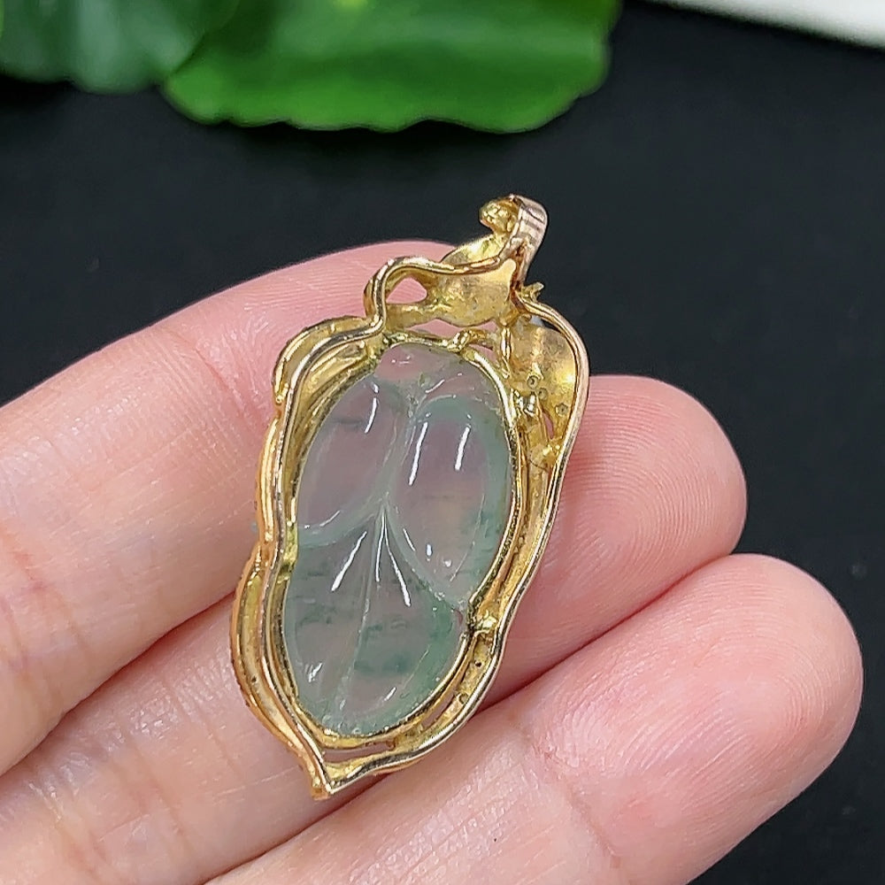 Jadeite leaf inlay pendant with 18K gold and diamond accents, weighing approximately 6.6g, crafted by HKHQ.