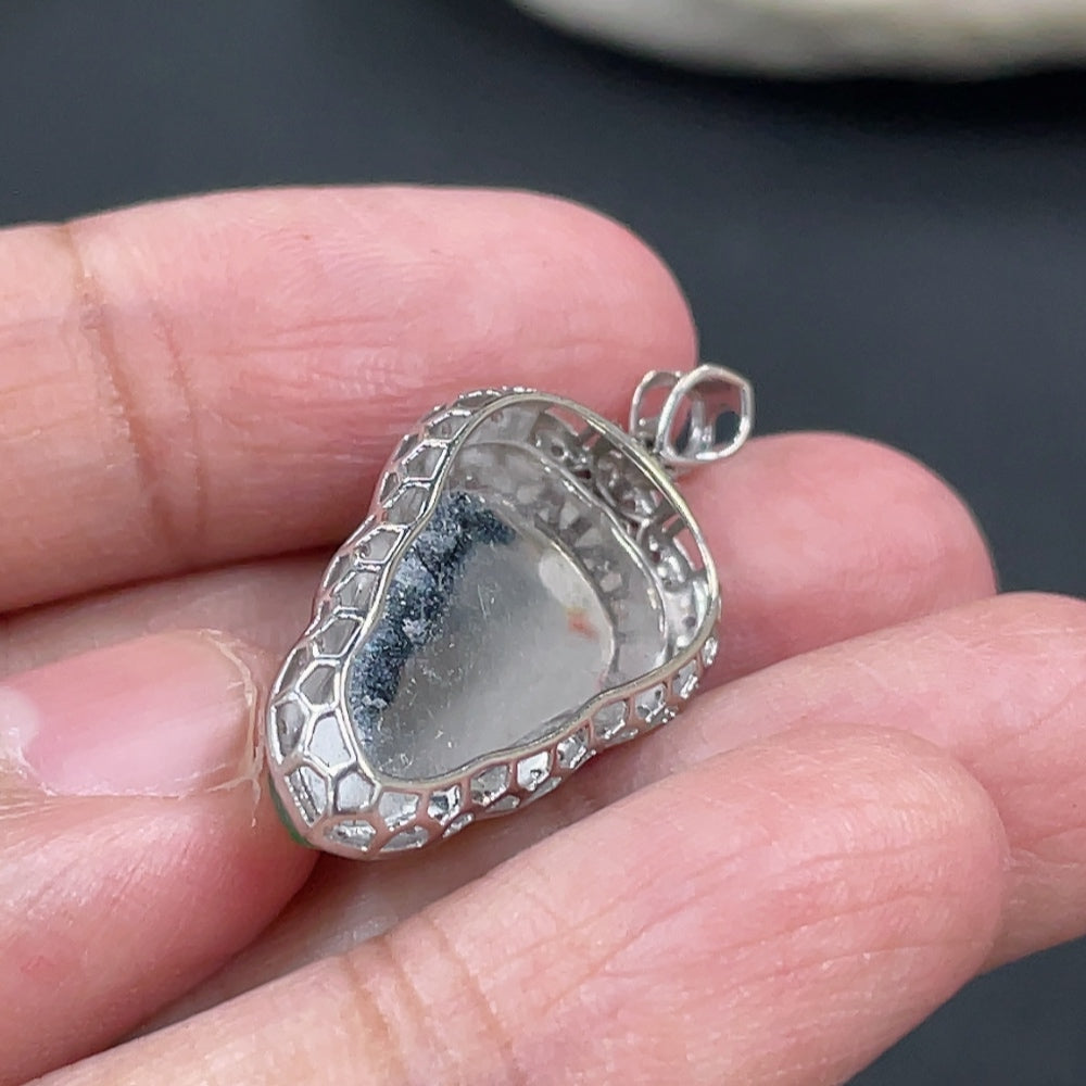 Jadeite leaf inlay pendant with 18k gold and diamond accents, showcasing intricate craftsmanship and natural jade color.