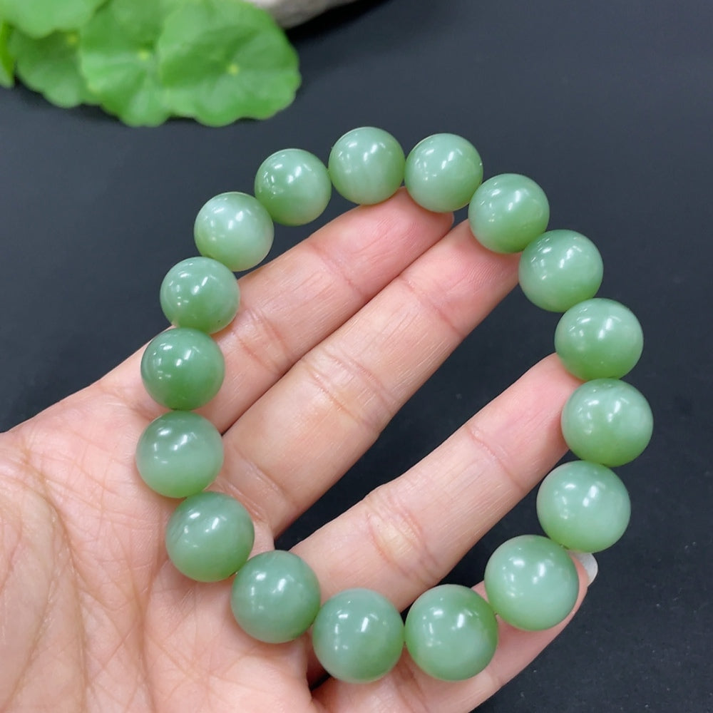 HKHQ Hetian Jade Jasper bracelet with 11.7mm beads, weighing approximately 44.5g, featuring smooth, polished jade stones.