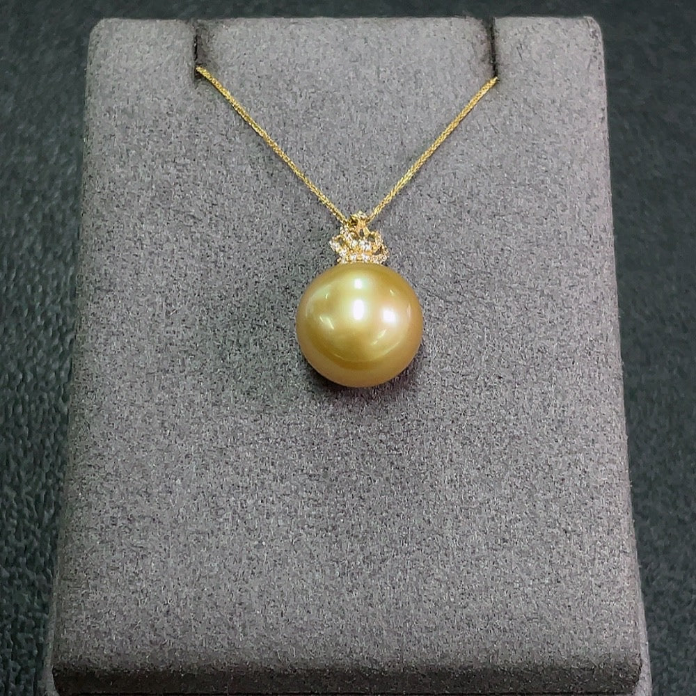 Seawater pearl pendant with 18K gold setting, 12.4mm pearl, on a chain, showing the elegant jewelry design with natural pearl finish.