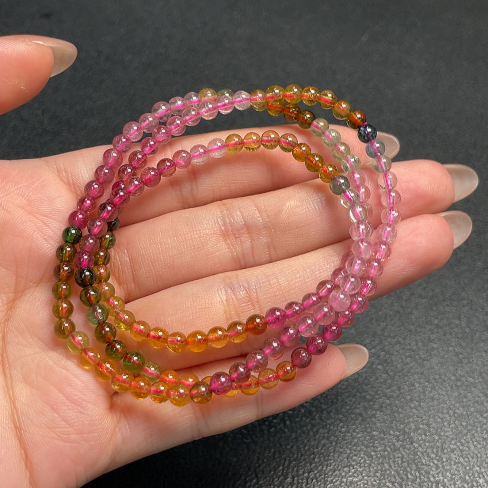 HKHQ tourmaline bead gemstone necklace with 3.8mm beads and visible organic matter, showcasing natural gemstone beauty.