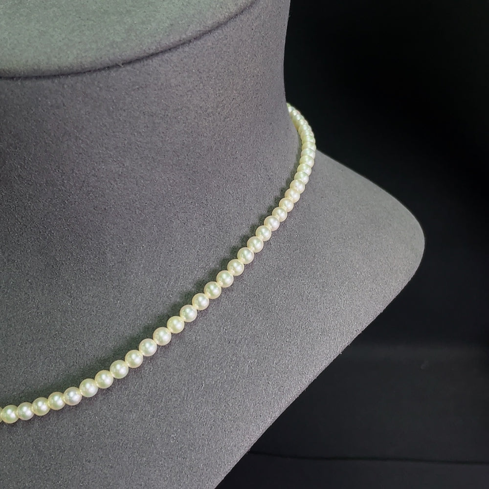 Seawater pearl strand featuring 4-4.4mm pearls, non-gold, with a total weight of 12.04g, displayed on a neutral background.