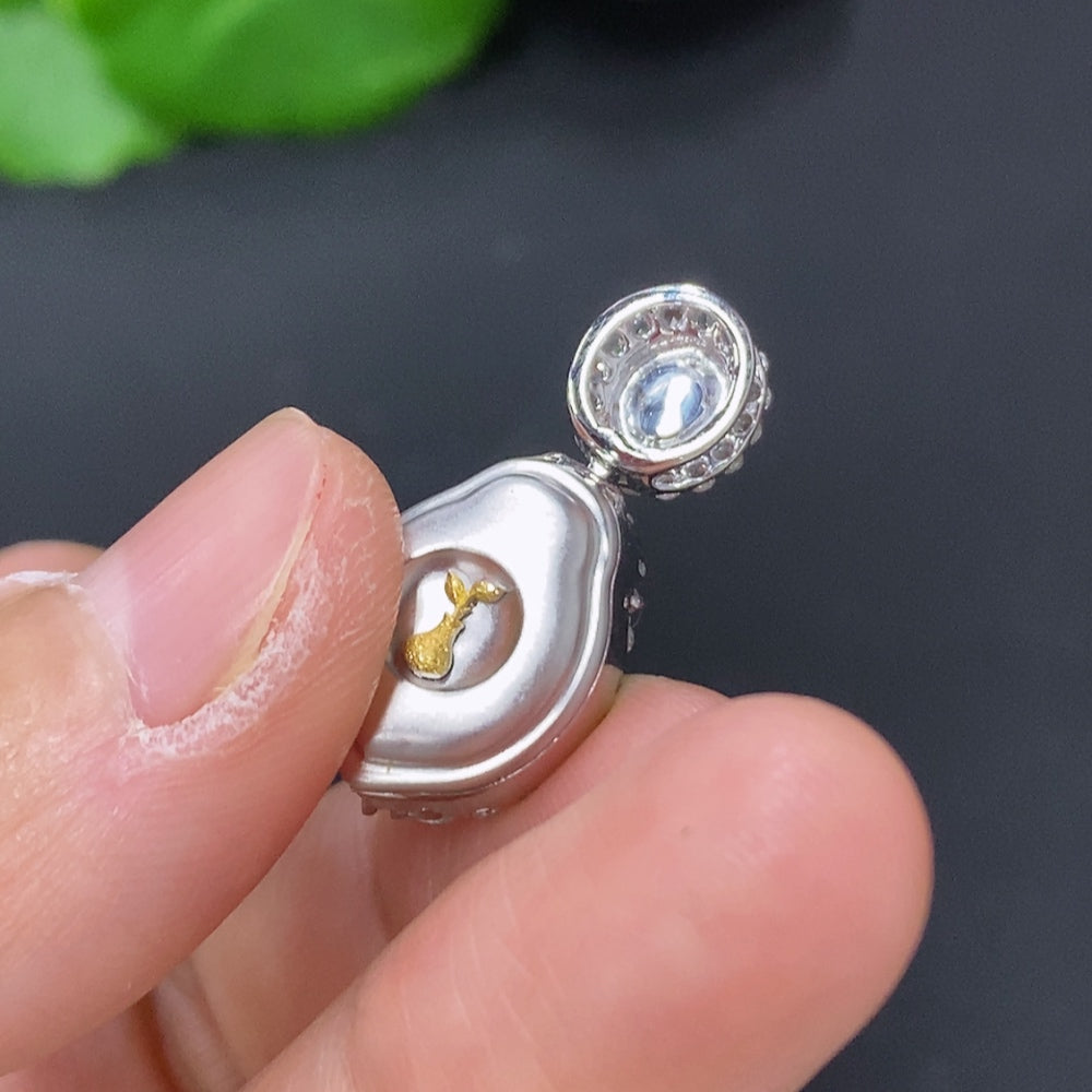 Jadeite cabochon pendant with diamond accents in 18K gold, HKHQ, showcasing a polished green jade stone with elegant gold setting