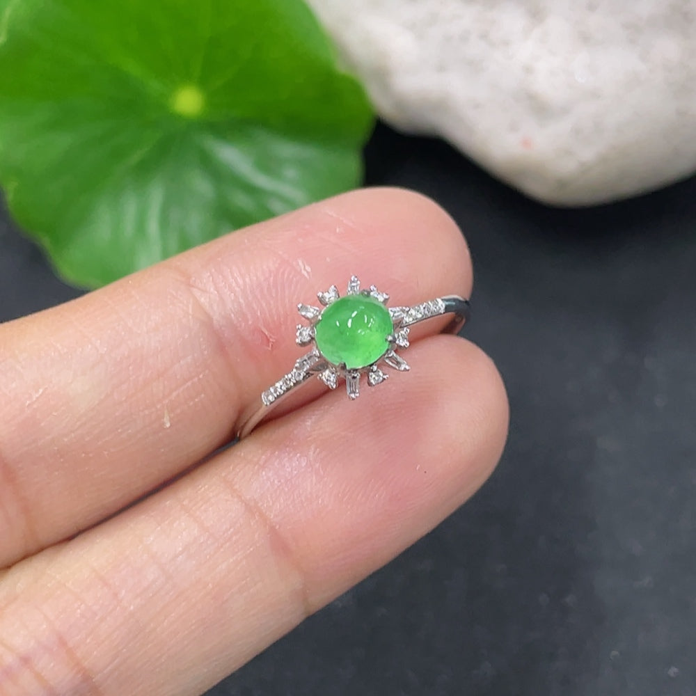 Jadeite cabochon ring with 18K gold setting and diamond accents, size 14, featuring a smooth green jade stone.