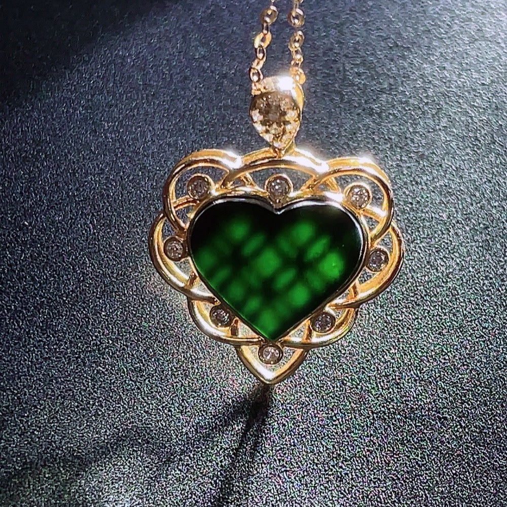 Jadeite heart-shaped pendant with 18k gold and diamond accents