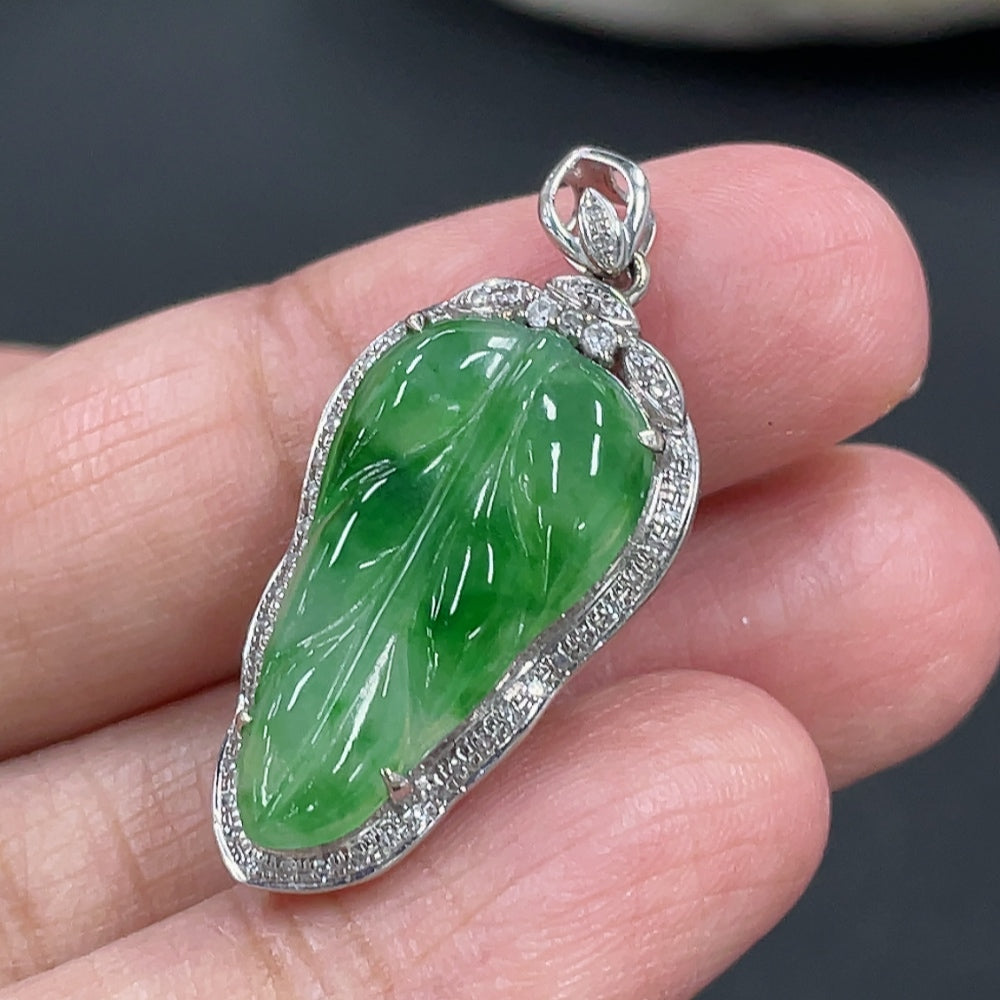 Jadeite leaf inlay pendant with 18k gold and diamond accents, weighing approximately 3g, from HKHQ.