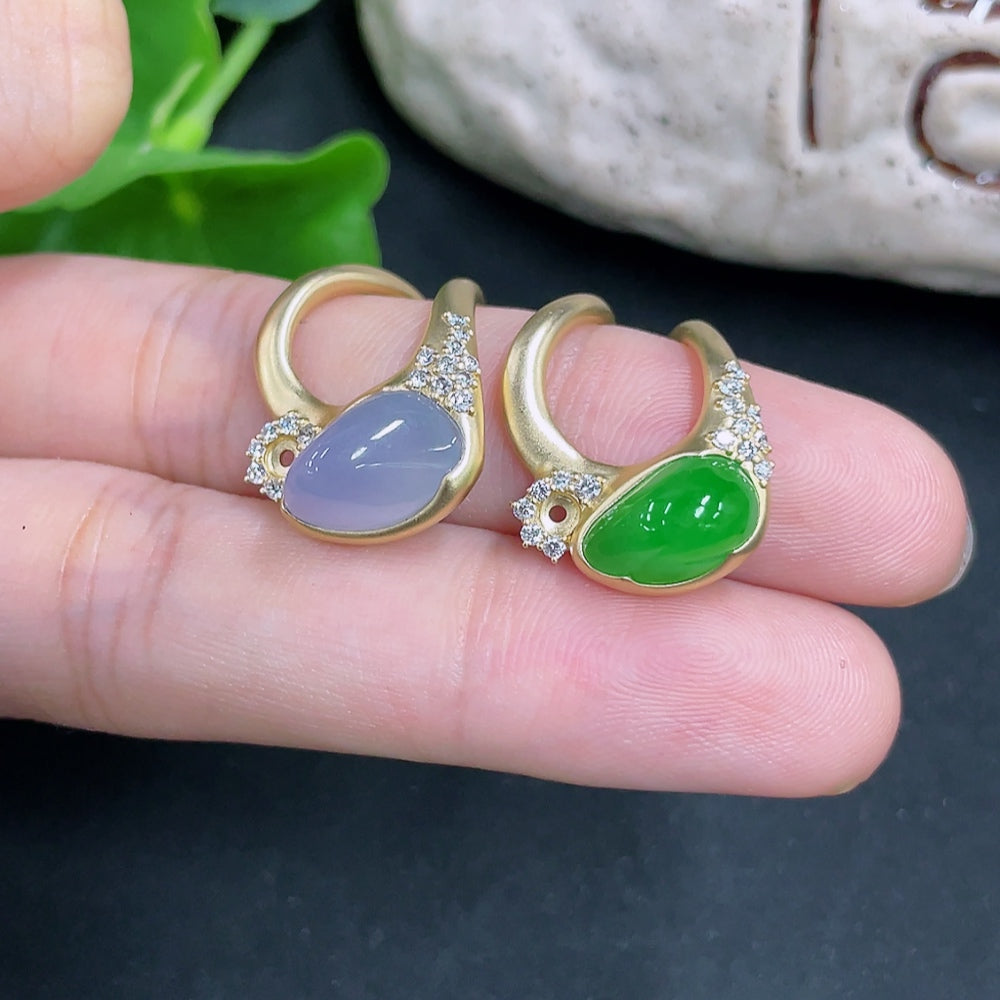 Jadeite inlaid ring with diamond accents in 18k gold, unmarked, weighing approximately 6.7g, from HKHQ.