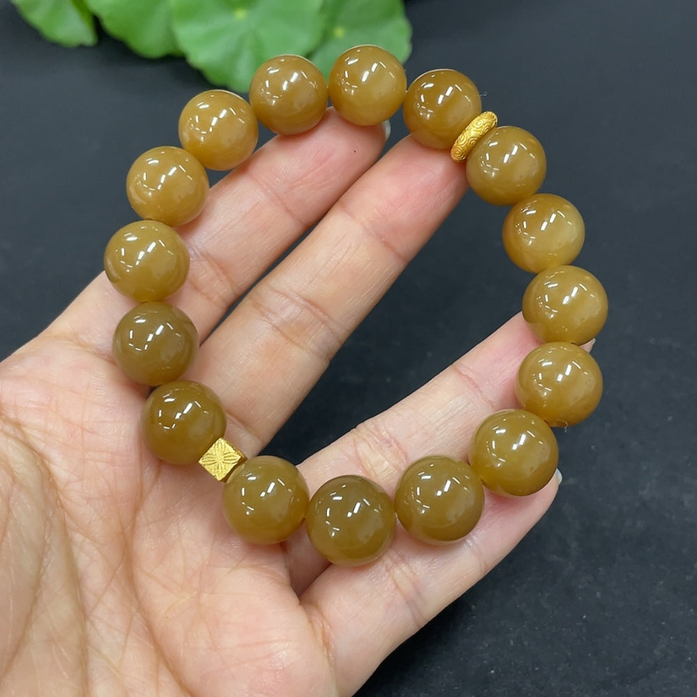 HKHQ Hetian jade bead bracelet with 11.7mm non-gold jade beads, approximately 43.7g weight, showcasing smooth, polished jade stones.