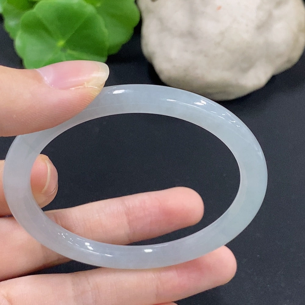 Jadeite round bangle in size 55.7 with a total weight of 23.89g, featuring smooth, polished jade surface, from HKHQ.