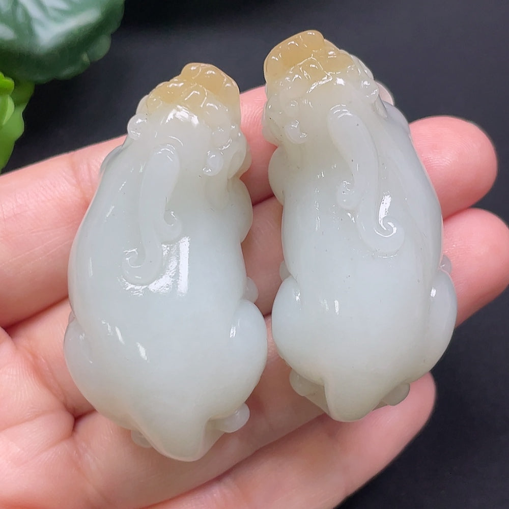 Hetian Jade Pixiu pendant from HKHQ featuring a detailed carved design, weighing approximately 73.49g.