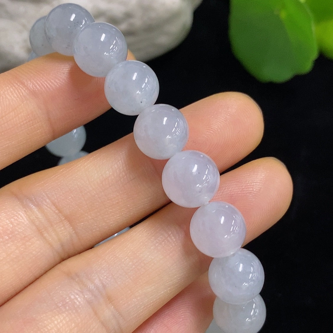 HKHQ jadeite bracelet with 9.6mm beads, weighing approximately 31.93g, showcasing smooth, polished green jadeite stones.