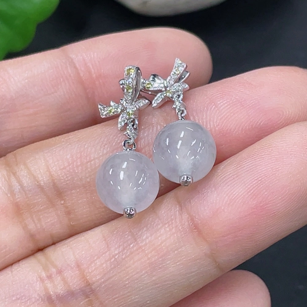 Jadeite earrings set in 18k gold with diamond accents, total product weight approximately 3.07g